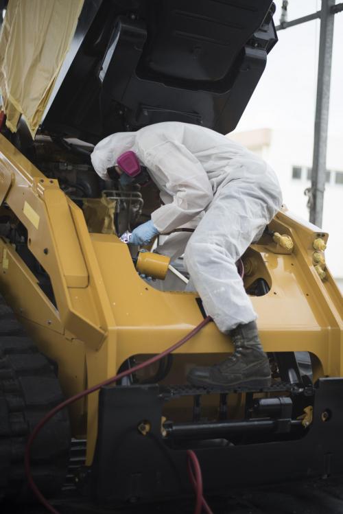Figure 3: Spraying Coatings Inside Engine Compartment to Provide Extra Protection Against the Corrosive Environment (Source: Senior Airman Omari Bernard, 18th Wing Public Affairs).