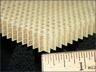  An Image of a Negative Index of Refraction Metamaterial Array Configuration, which was Constructed of Copper Split-Ring Resonators and Wires Mounted on Interlocking Sheets of Fiberglass Circuit Board (left). on the Right is a Comparison of Refraction in a Left-Handed Metamaterial to that in a Normal Material (Source: Wikipedia.com).