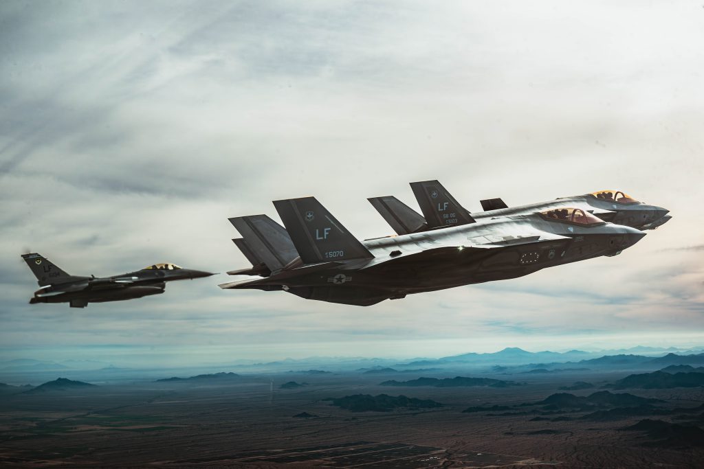 USAF F-35A Lightning II’s and an F-16 Fighting Falcon aircraft fly in formation