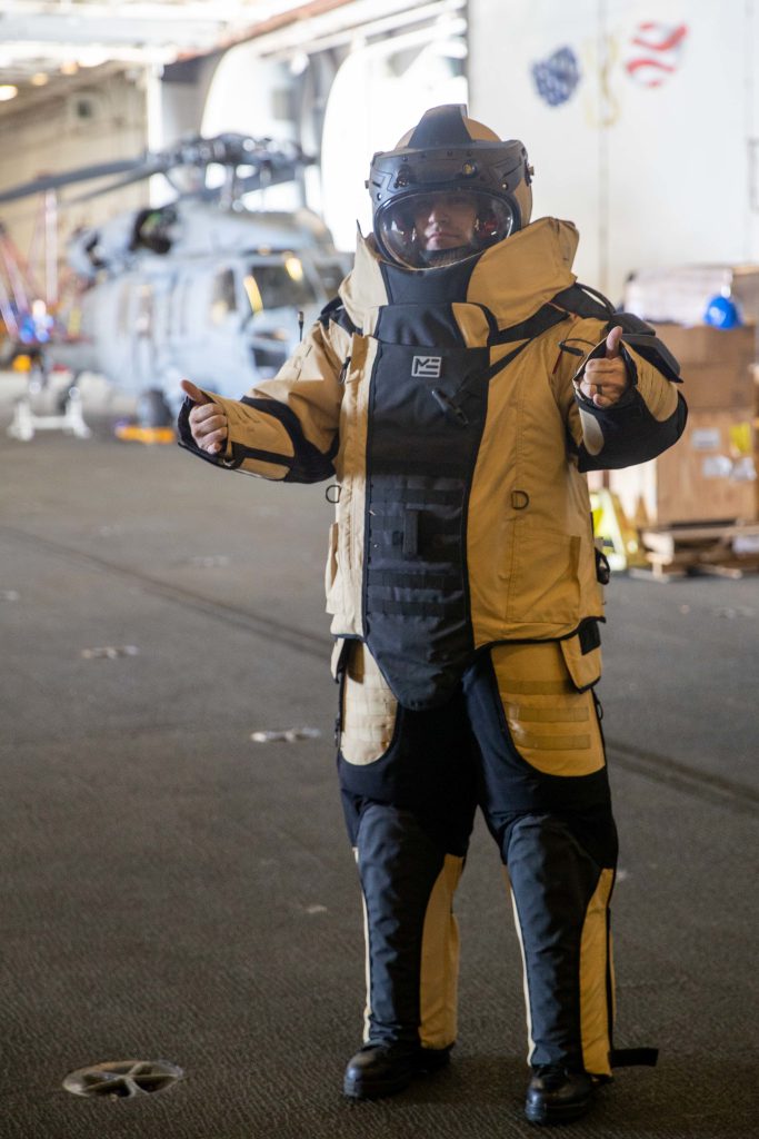 Aviation Boatswain's Mate (Handling) Airman David Douglas, from Myrtle Beach, South Carolina, assigned to the first-in-class aircraft carrier USS Gerald R. Ford’s (CVN 78) air department, wears an explosive device disposal suit, Sept. 21, 2022. Ford is underway in the Atlantic Ocean conducting carrier qualifications and workups for a scheduled deployment this fall. (U.S. Navy photo by Mass Communication Specialist Seaman Apprentice Daniel Perez)