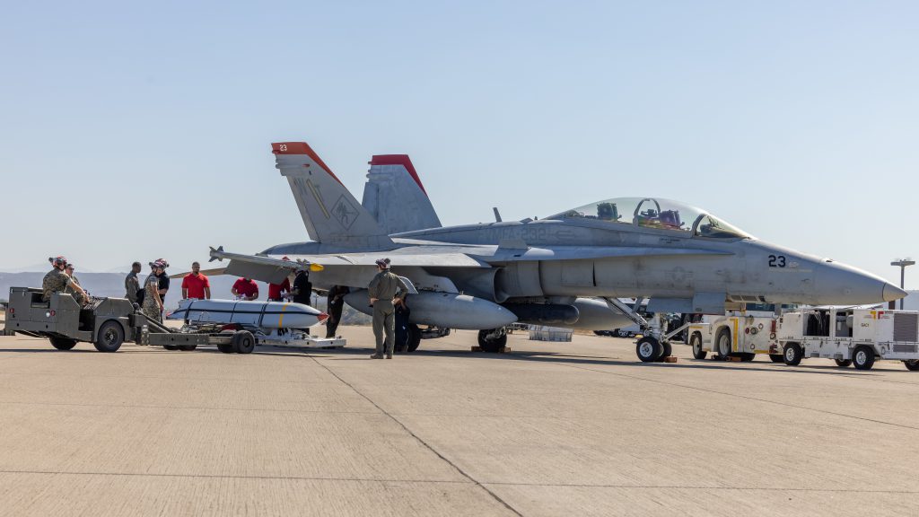 Marines with 3rd Marine Aircraft Wing load an AGM-158A joint air-to-surface standoff missile (JASSM) on an F/A-18 Hornet