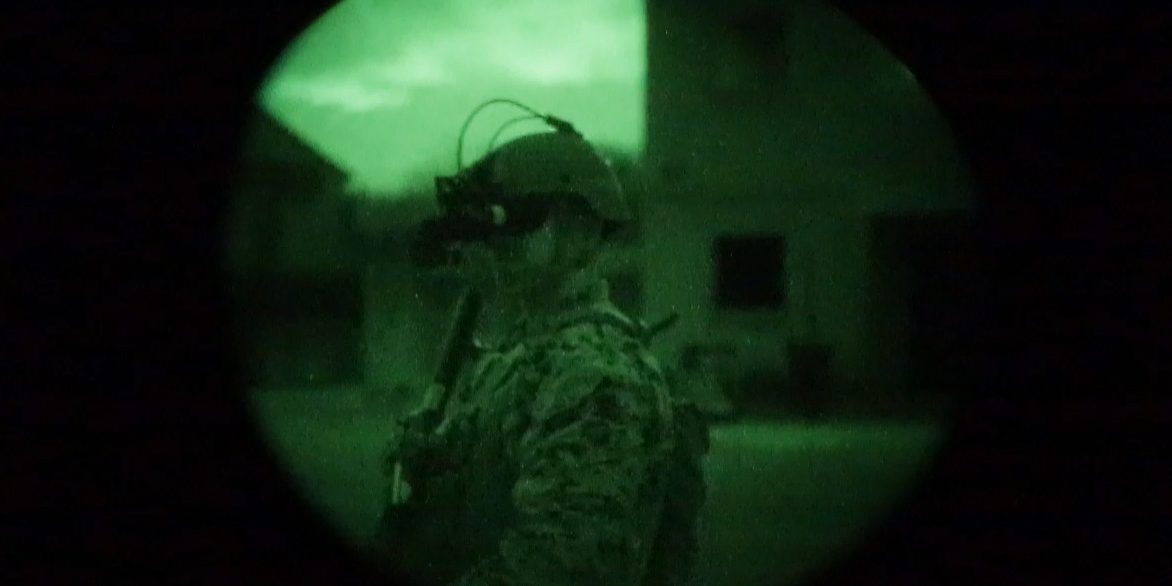 A view of a Marine through the Squad Binocular Night Vision Goggle at night. In January, a group of Marines with The Basic School assessed the Squad Binocular Night Vision Goggle—night vision system comprising an image-intensifier binocular and enhanced clip-on thermal imager (U.S. Marine Corps photo by Sgt. Kirstin Spanu).