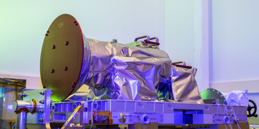 NASA’s Atmospheric Waves Experiment, or AWE, is shown with its remove-before-flight covers in this photo taken on May 26, 2023, at Utah State University’s Space Dynamics Laboratory (SDL) (credits:  SDL/Allison Bills).