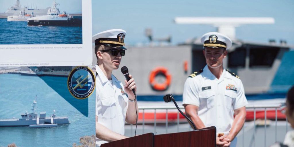 Sailors from Unmanned Surface Vessel Squadron One (USVRON-1) discuss the Medium Displacement Unmanned Surface Vessel (MDUSV) Sea Hunter and the Navy’s advances in unmanned systems with the public during LA Fleet Week, 24 May. USVRON-1’s mission is to test, evaluate, and operate in support of integrating medium and large unmanned surface vessels into fleet operations and to conduct developmental operations for the fleet. USVRON-1 also supports the Navy’s efforts to establish the Robotics Warfare Specialist Rating (RW) (photo by U.S. Navy).