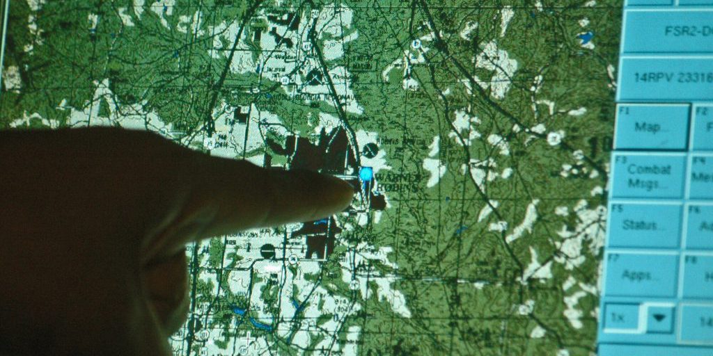 Integration engineer Willie Jackson shows units presently located at Robins Air Force Base, GA, using the Blue Force Tracker system. Friendly units are indicated by a blue dot (courtesy of U.S. Air Force photo/Sue Sapp) source: https://www.af.mil/News/Photos/igphoto/2000648819/.