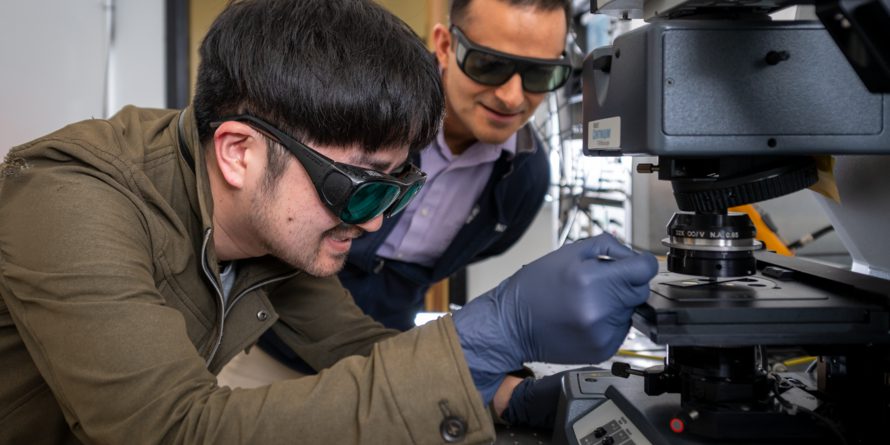 Naoki Higashitarumizu (left), Postdoctoral Researcher, Electrical Engineering and Computer Sciences, UC Berkeley, and Ali Javey, Professor, Electrical Engineering and Computer Sciences, UC Berkeley, prepare samples on a Fourier-transform infrared spectroscopy (FTIR) at Corey Hall on the University of Berkeley campus, Berkeley, California, 03/22/2023. Higashitarumizu and Javey are authors on a paper "Anomalous Thickness Dependence of Photoluminescence Quantum Yield in Black Phosphorous" in Nature Nanotechnology.