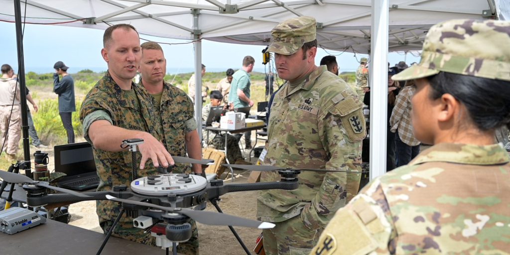 Marines discussing unmanned vehicle