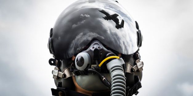 1st Lt. Anton King, 75th Fighter Squadron pilot, poses for a photo wearing an HGU-55/P helmet fitted with hybrid optical-based inertial tracker and day visor on February 11, 2020, at Moody Air Force Base, GA.  The helmet provides A-10C Thunderbolt II pilots a central interface for everything they need, from the oxygen supply to communications to flight instruments. (U.S. Air Force photo illustration by Airman 1st class Hayden Legg). (This image was manipulated by merging two photos in Adobe Photoshop.) Source:  https://www.moody.af.mil/News/Article-Display/Article/2085359/a-10-helmets-keep-pilots-connected/