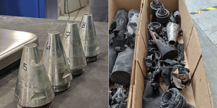 Left: Fuzes sit on a table at the Anniston Army Depot in Alabama. The fuzes were removed from M56 rocket warheads for testing in the Anniston Static Detonation Chamber (SDC) unit. The test results will help determine rocket process times and expectations for the two SDC units at the Blue Grass Chemical Agent-Destruction Pilot Plant. Right: The scrap from processing test rocket warheads in the Anniston SDC lies in boxes at the Anniston Army Depot. Technicians processed simulated rocket warheads in the Anniston SDC to determine rocket process times and expectations for the two SDC units at the Blue Grass Chemical Agent-Destruction Pilot Plant (source: https://www.peoacwa.army.mil/2022/10/27/simulated-warheads-prepared-for-systems-testing/).